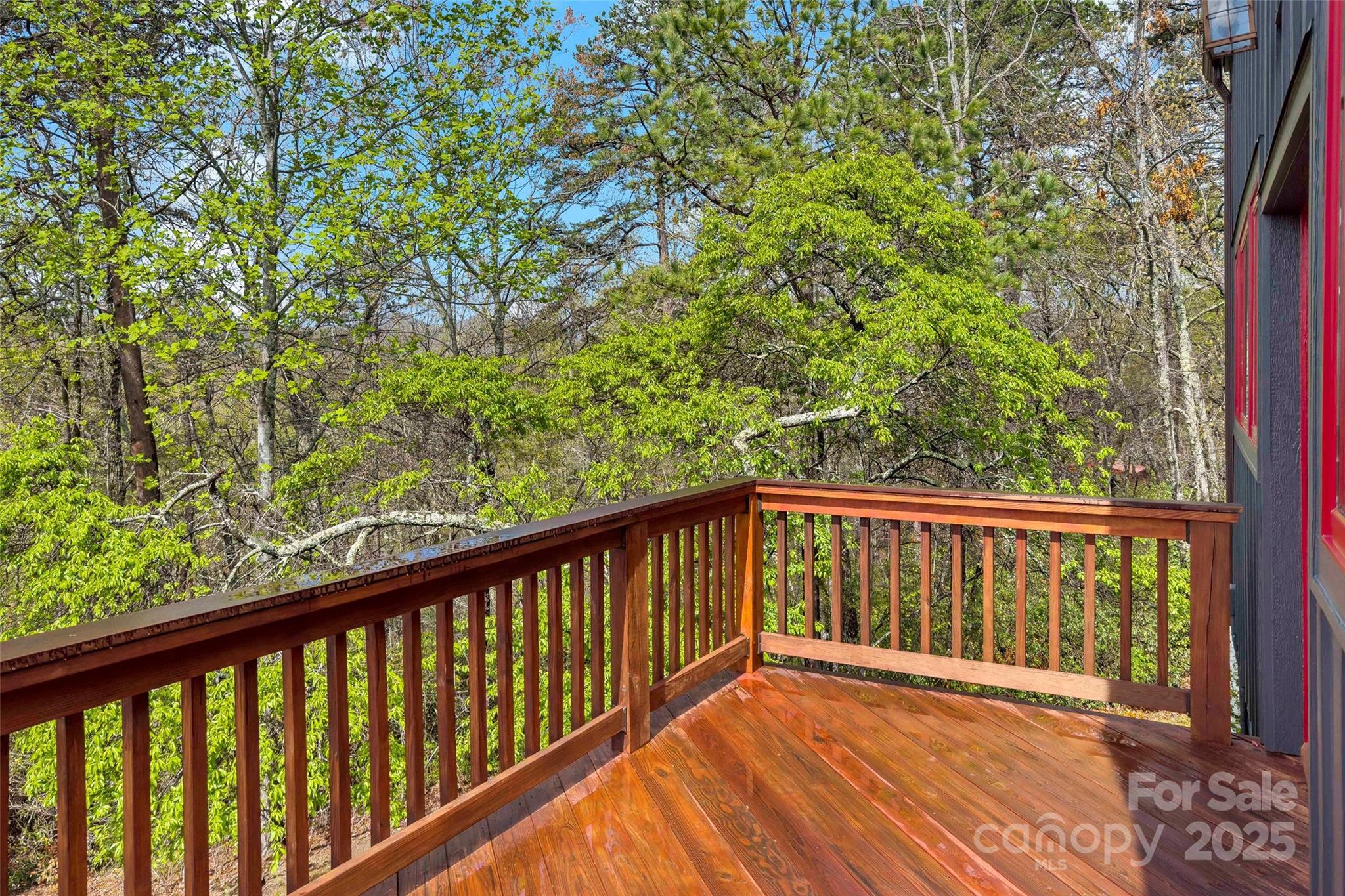 692 Hidden Acres Drive Marion, NC 28752 - Photo 11 of 48 a balcony with wooden floor and trees