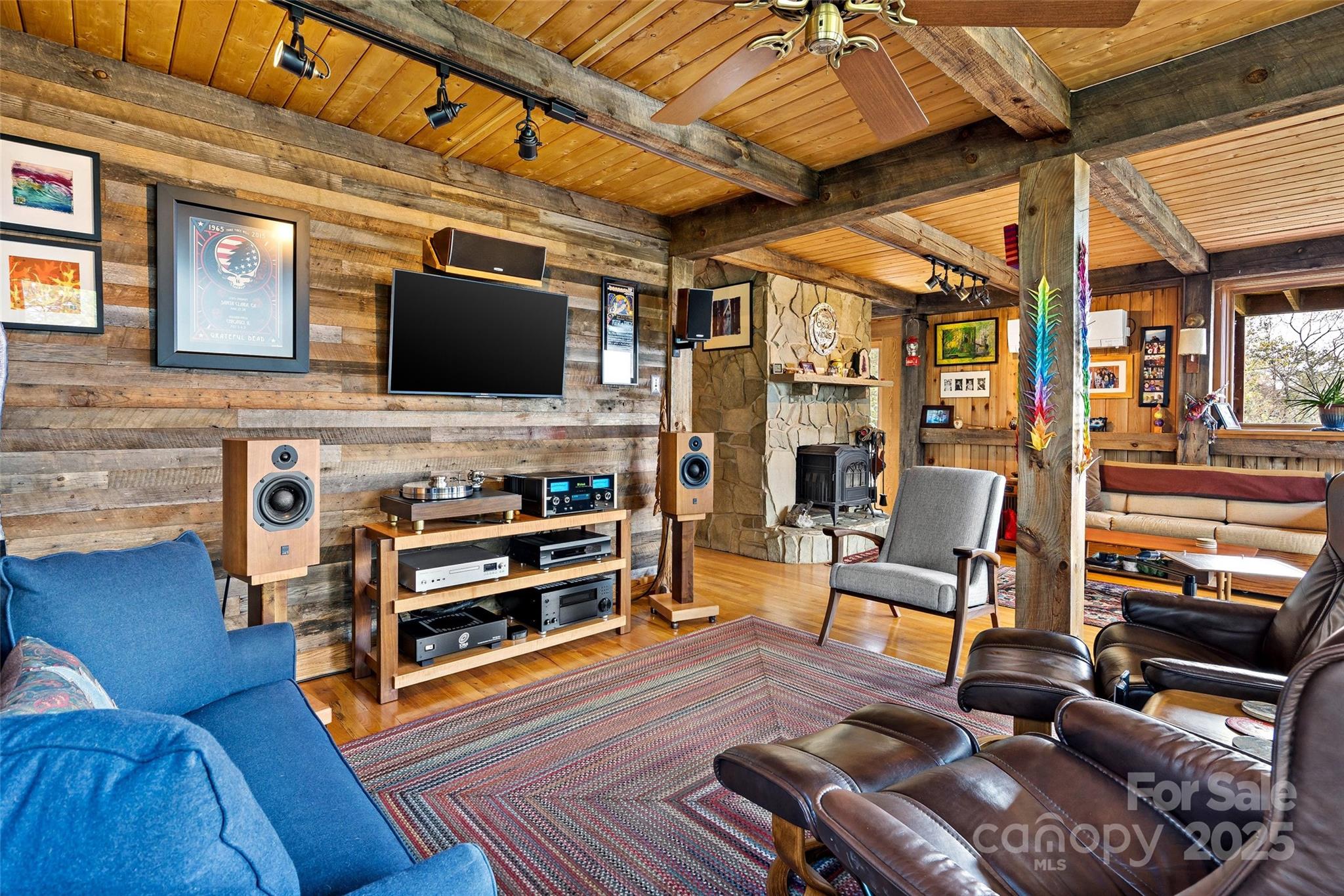 692 Hidden Acres Drive Marion, NC 28752 - Photo 14 of 48 a living room with furniture and a flat screen tv