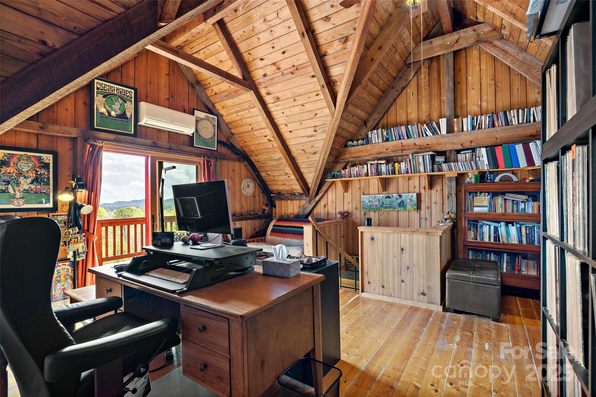 692 Hidden Acres Drive Marion, NC 28752 - Photo 23 of 48 a room with furniture and a book shelf