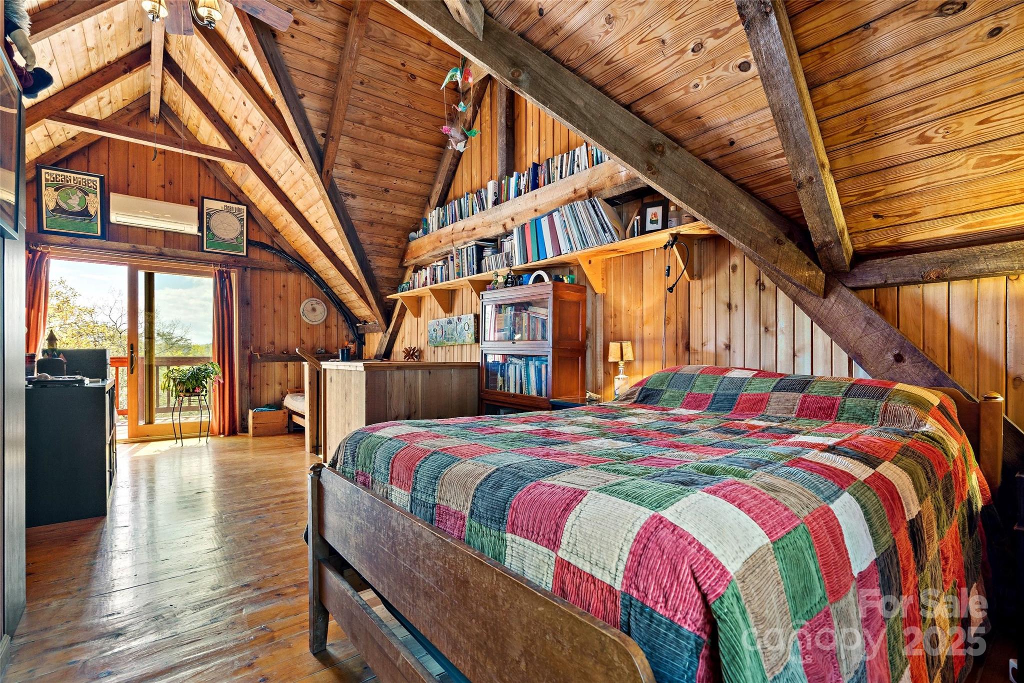 692 Hidden Acres Drive Marion, NC 28752 - Photo 27 of 48 a bedroom with a bed next to a large window