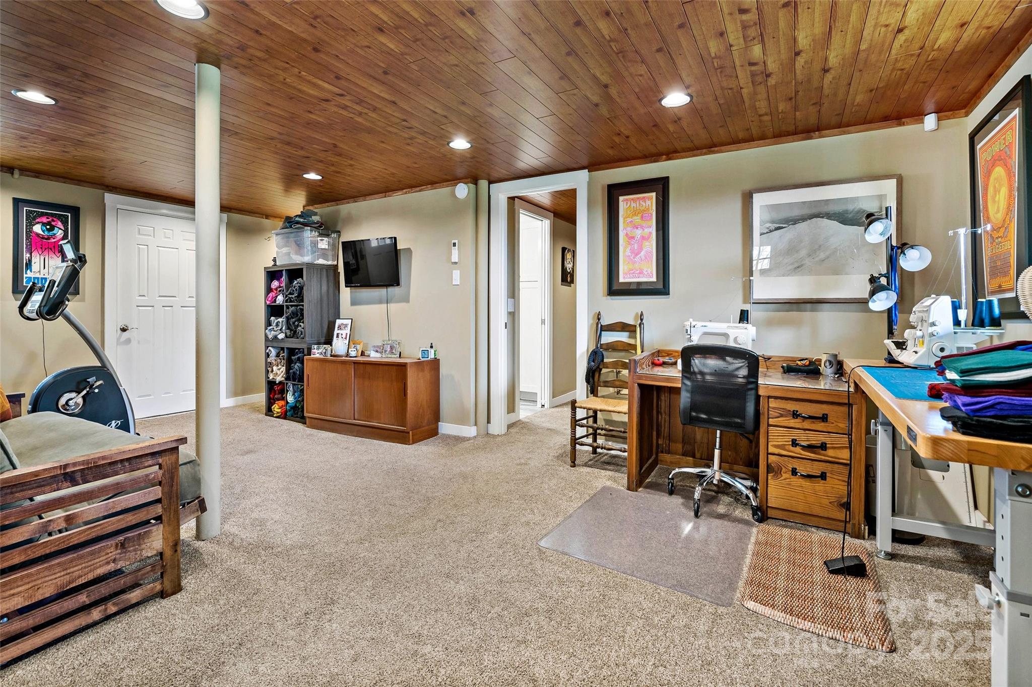 692 Hidden Acres Drive Marion, NC 28752 - Photo 31 of 48 a room with furniture and a flat screen tv