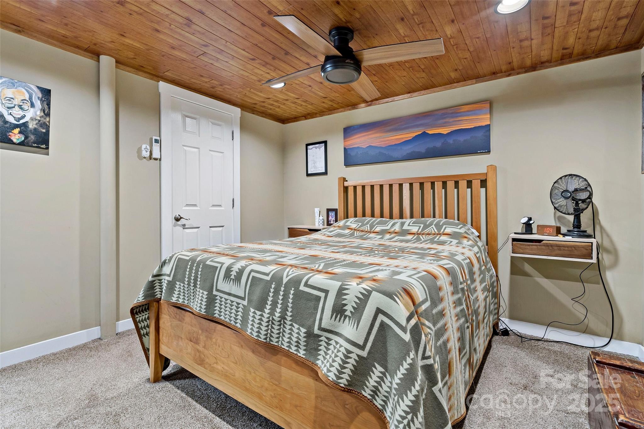 692 Hidden Acres Drive Marion, NC 28752 - Photo 34 of 48 a bed sitting in a bedroom next to a window