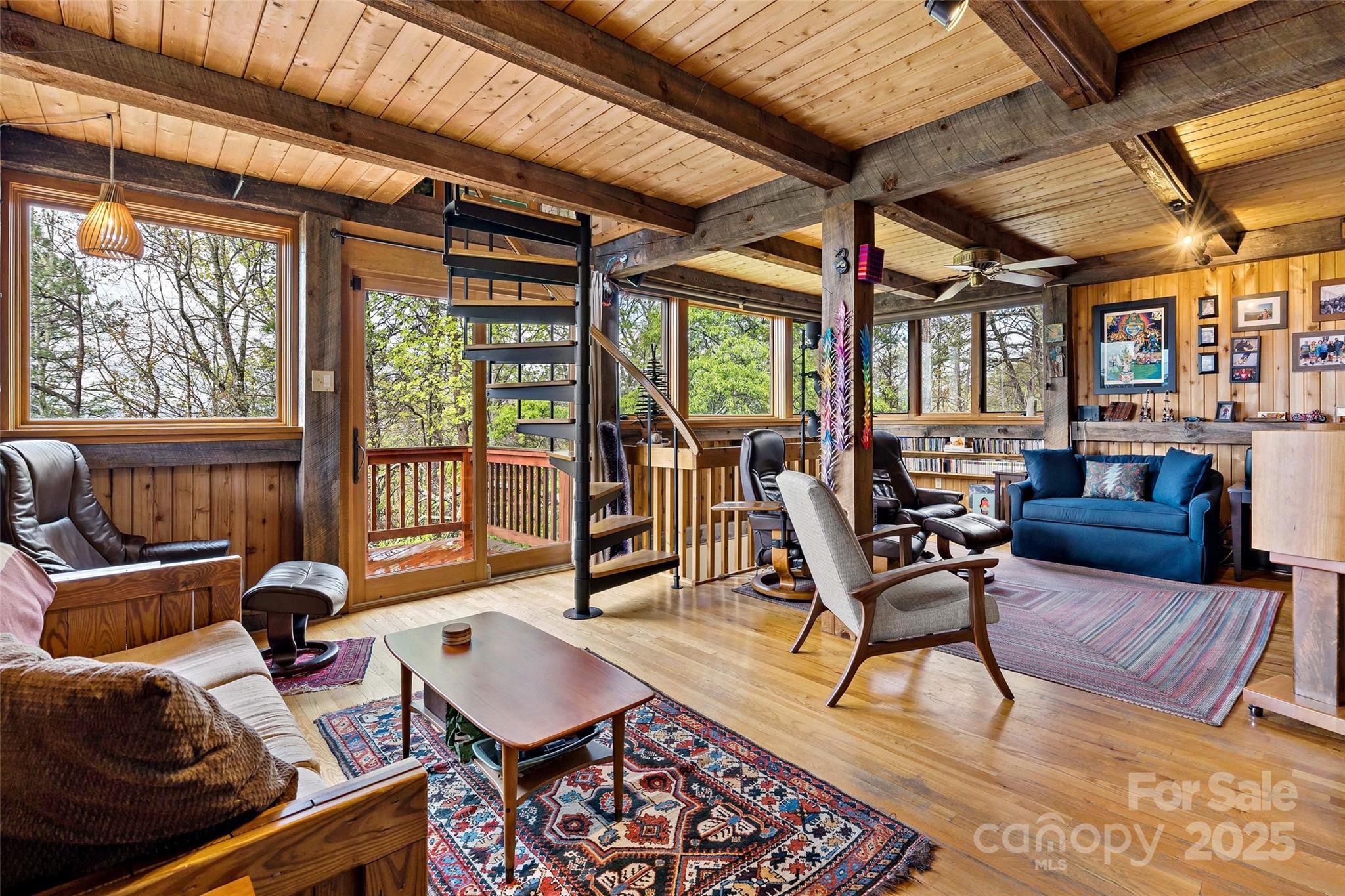 692 Hidden Acres Drive Marion, NC 28752 - Photo 7 of 48 a living room with furniture a rug and a large window