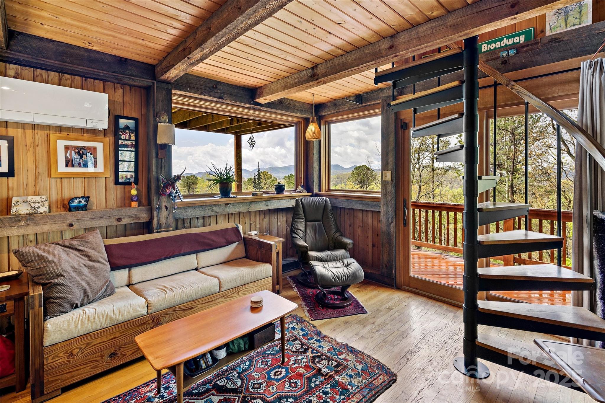692 Hidden Acres Drive Marion, NC 28752 - Photo 10 of 48 a living room with furniture and a floor to ceiling window