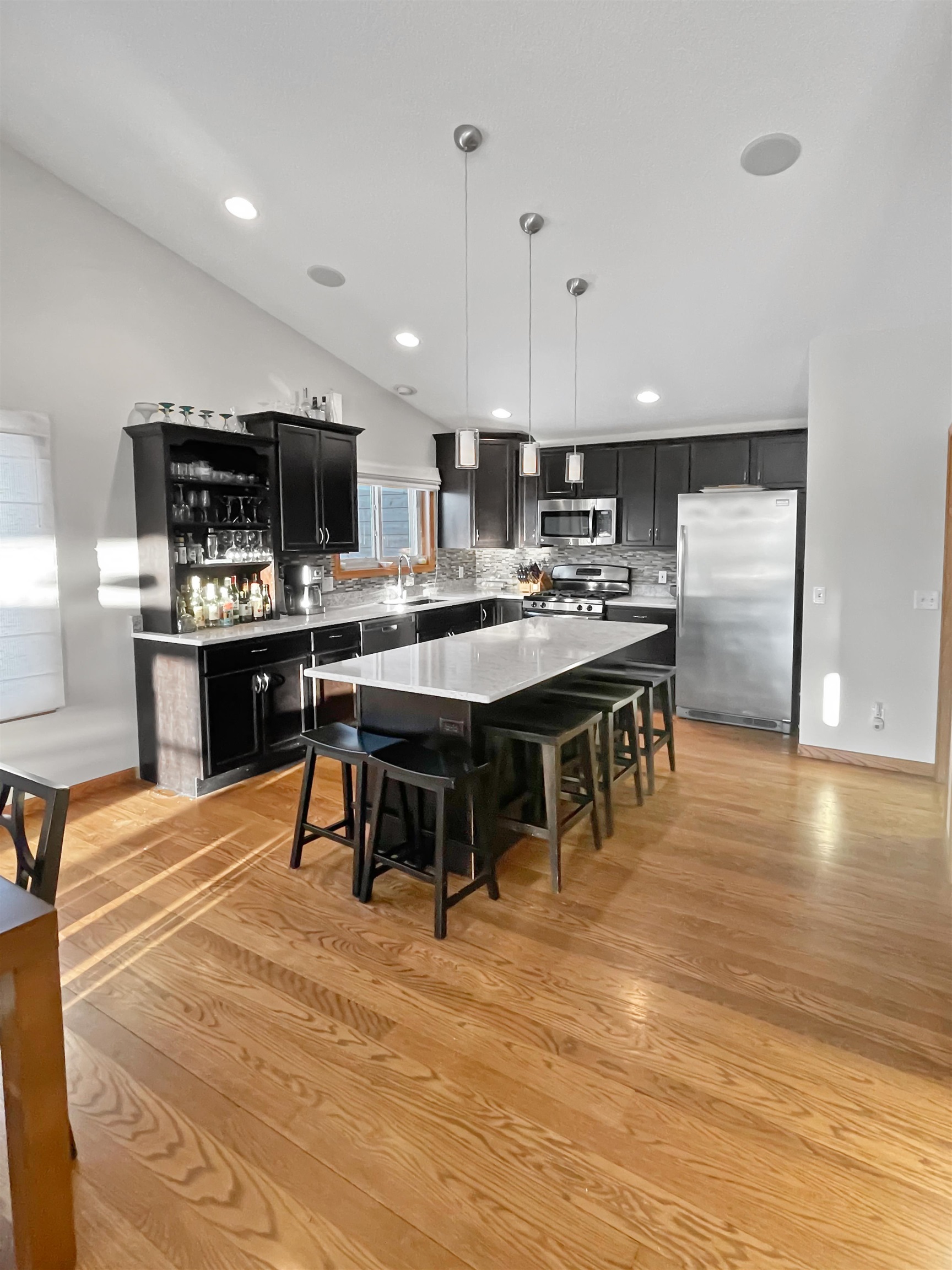 27-54 Ridgeview Drive Lake Carroll, IL 61046 - Photo 14 of 58 a large kitchen with a table and chairs in it