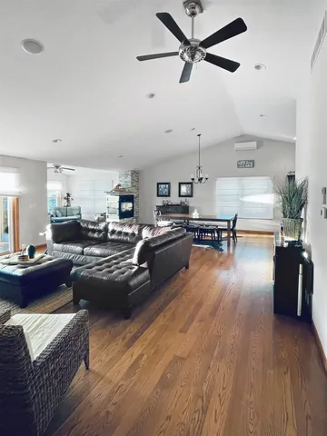 a bedroom with a bed and a ceiling fan