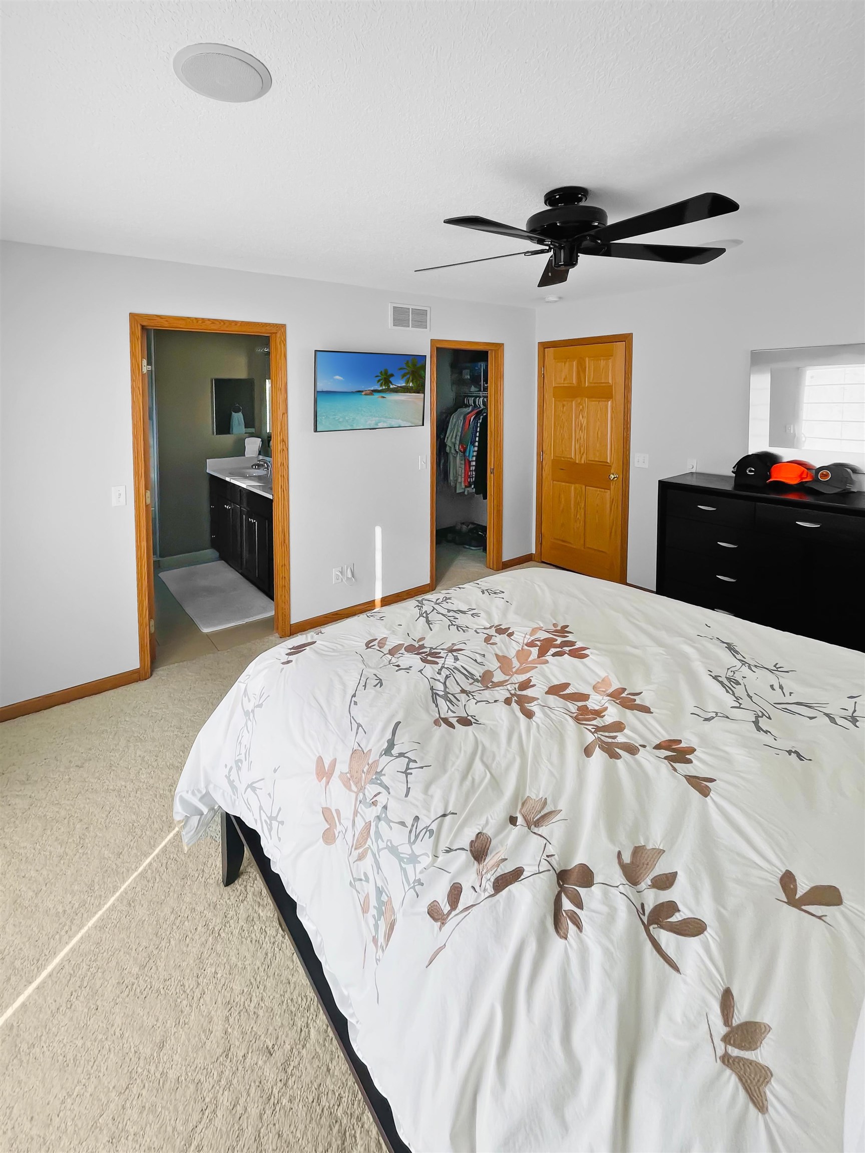 27-54 Ridgeview Drive Lake Carroll, IL 61046 - Photo 18 of 58 a bedroom with a bed and a ceiling fan