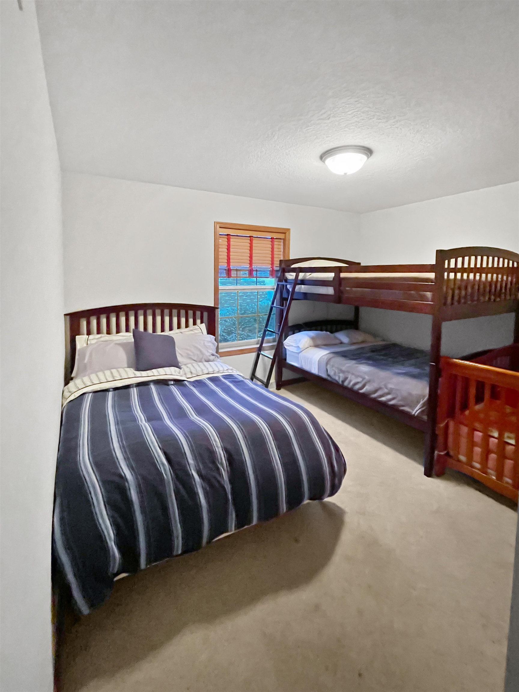 27-54 Ridgeview Drive Lake Carroll, IL 61046 - Photo 22 of 58 a bedroom with a bed and a window