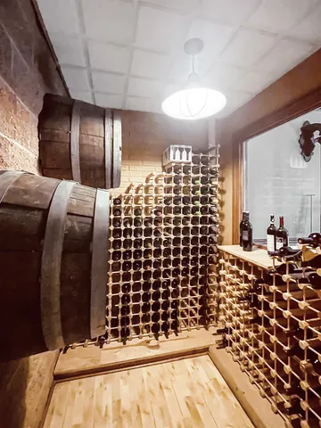 a view of a backyard with a garden and swimming pool