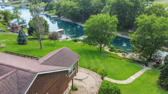 an aerial view of residential building with outdoor space and lake view