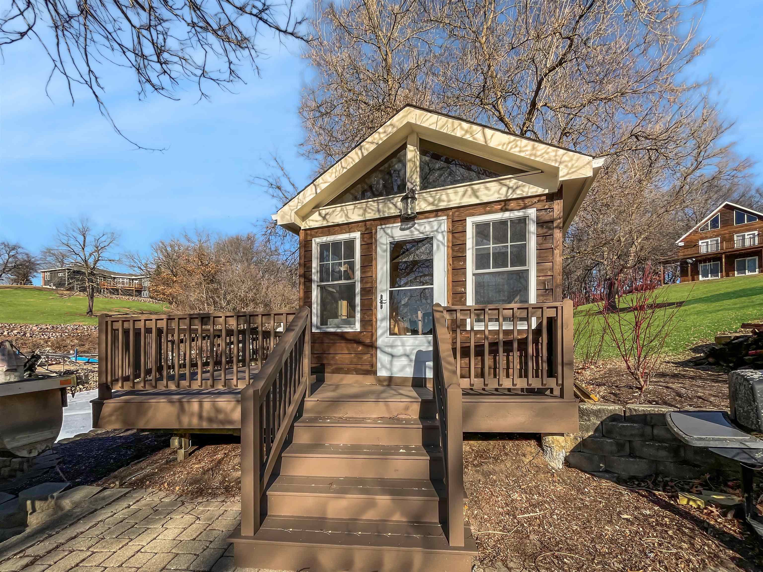 27-54 Ridgeview Drive Lake Carroll, IL 61046 - Photo 40 of 58 a view of a house with backyard and porch