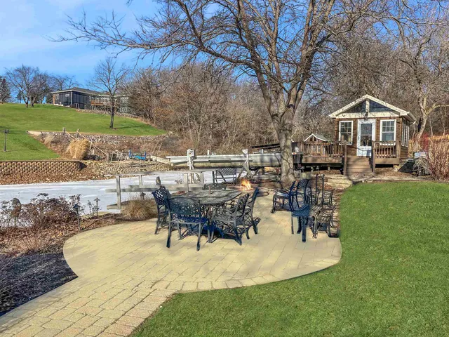 an aerial view of a house with a garden and a yard