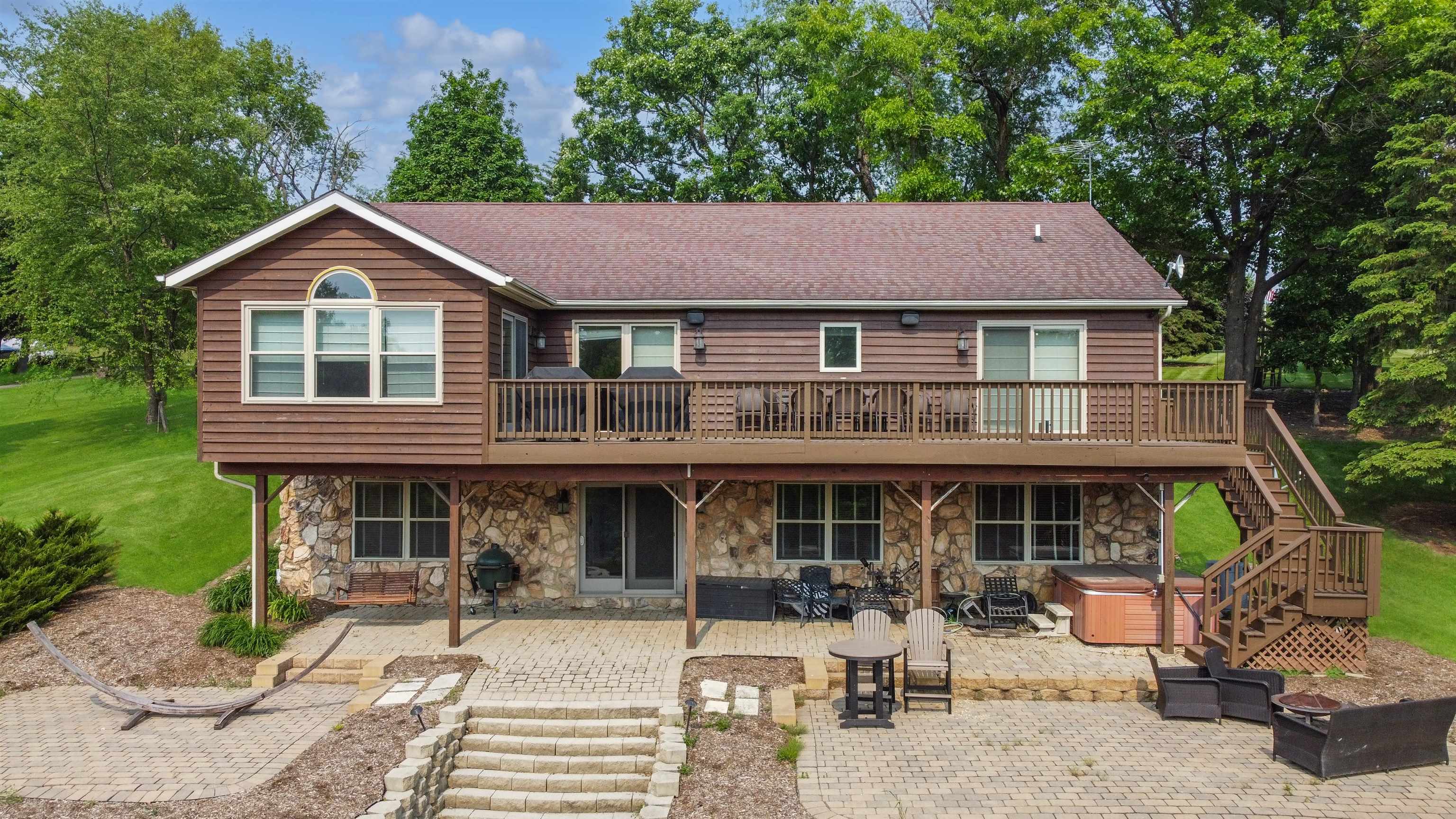 27-54 Ridgeview Drive Lake Carroll, IL 61046 - Photo 50 of 58 a front view of a house with garden and porch