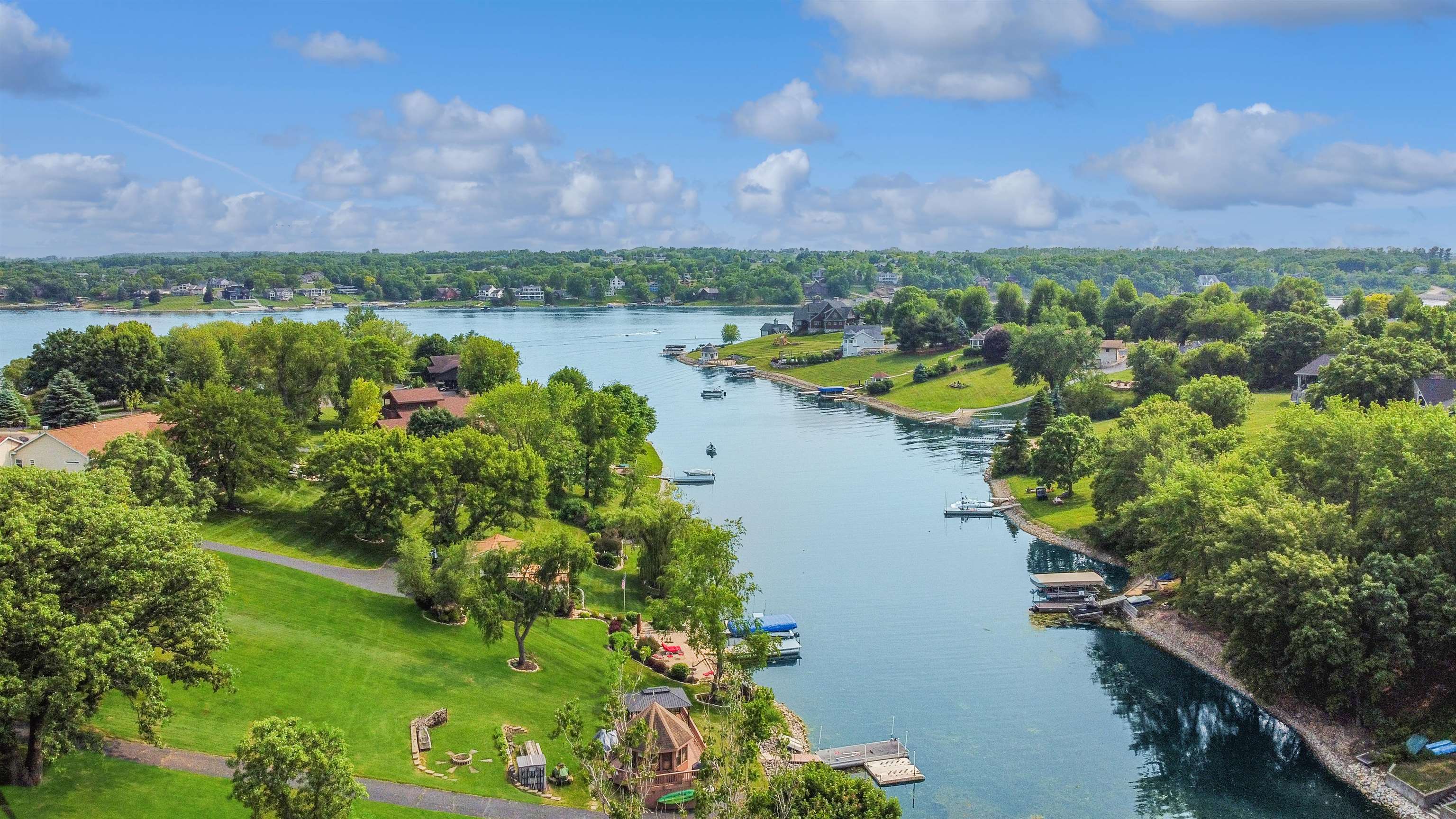 27-54 Ridgeview Drive Lake Carroll, IL 61046 - Photo 55 of 58 a view of a lake with houses in the back