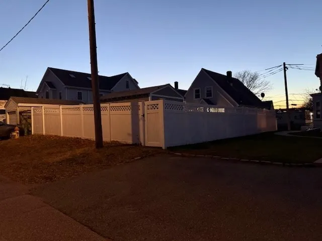 a front view of a house with a street