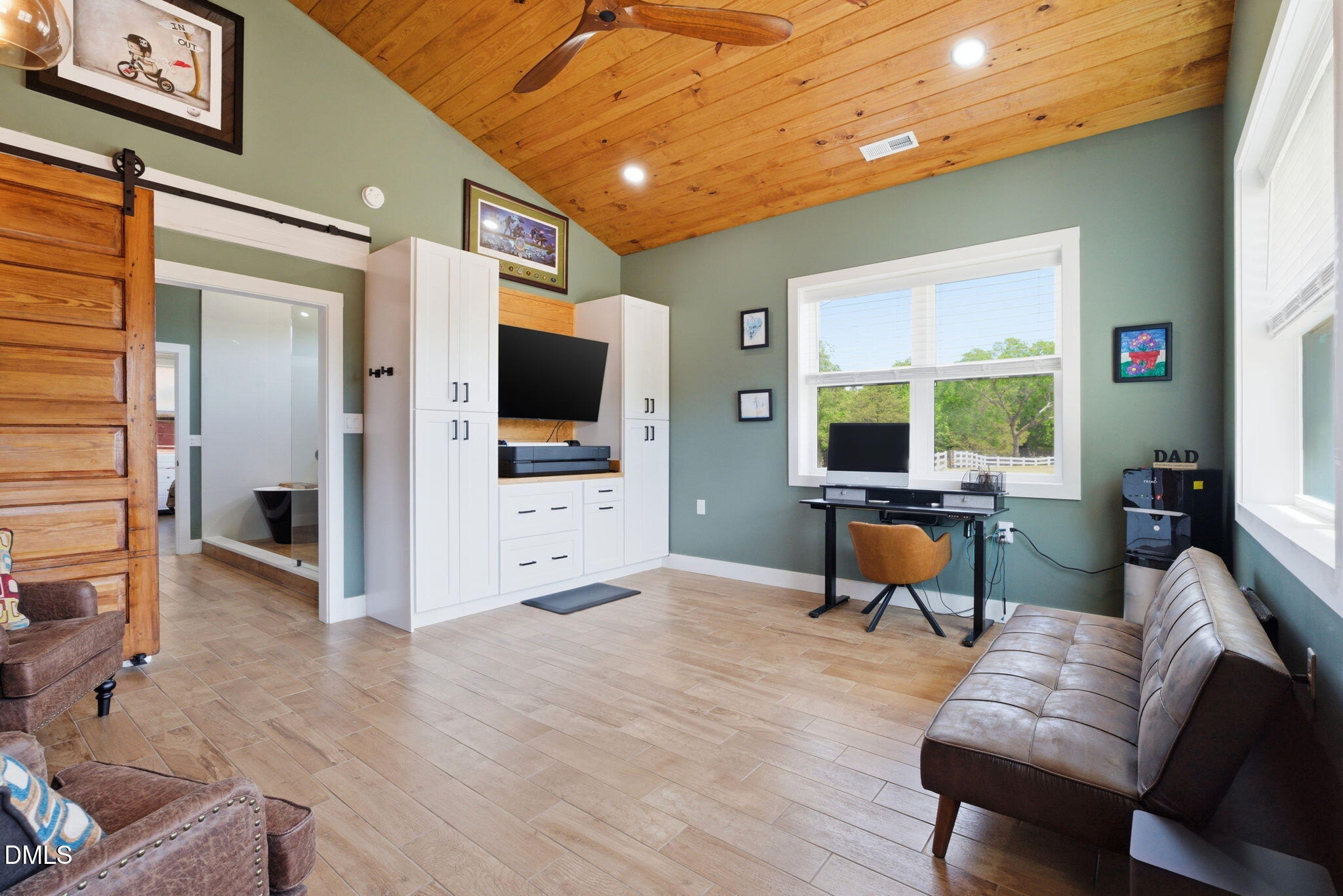 5416 Pulley Town Road Zebulon, NC 27597 - Photo 59 of 74 a living room with furniture and a flat screen tv
