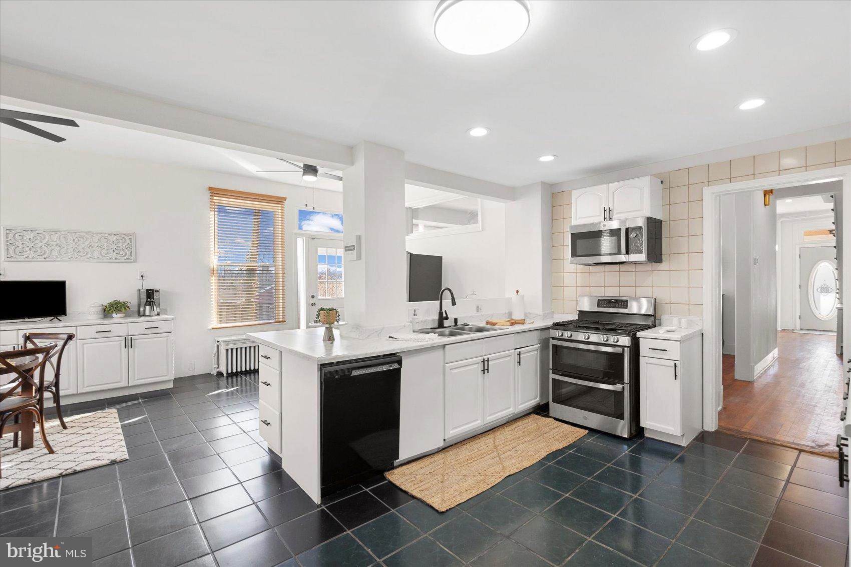 6602 Krone Drive Baltimore, MD 21207 - Photo 15 of 49 a large kitchen with stainless steel appliances lots of counter top space