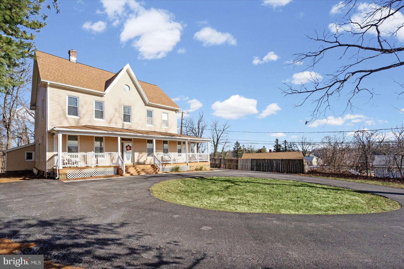 6602 Krone Drive Baltimore, MD 21207 - Photo 2 of 49 a front view of a house with a yard and potted plants