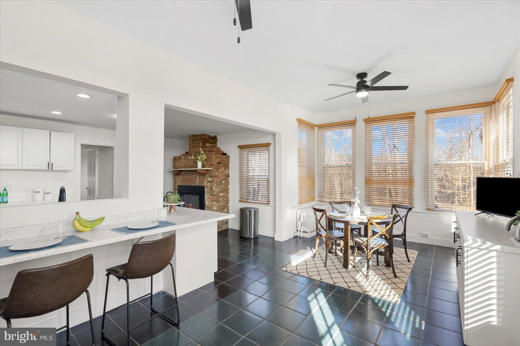 6602 Krone Drive Baltimore, MD 21207 - Photo 22 of 49 a view of a dining room with furniture window and outside view