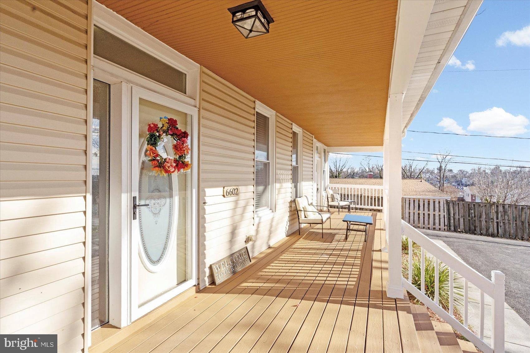 6602 Krone Drive Baltimore, MD 21207 - Photo 3 of 49 a view of a balcony with wooden floor