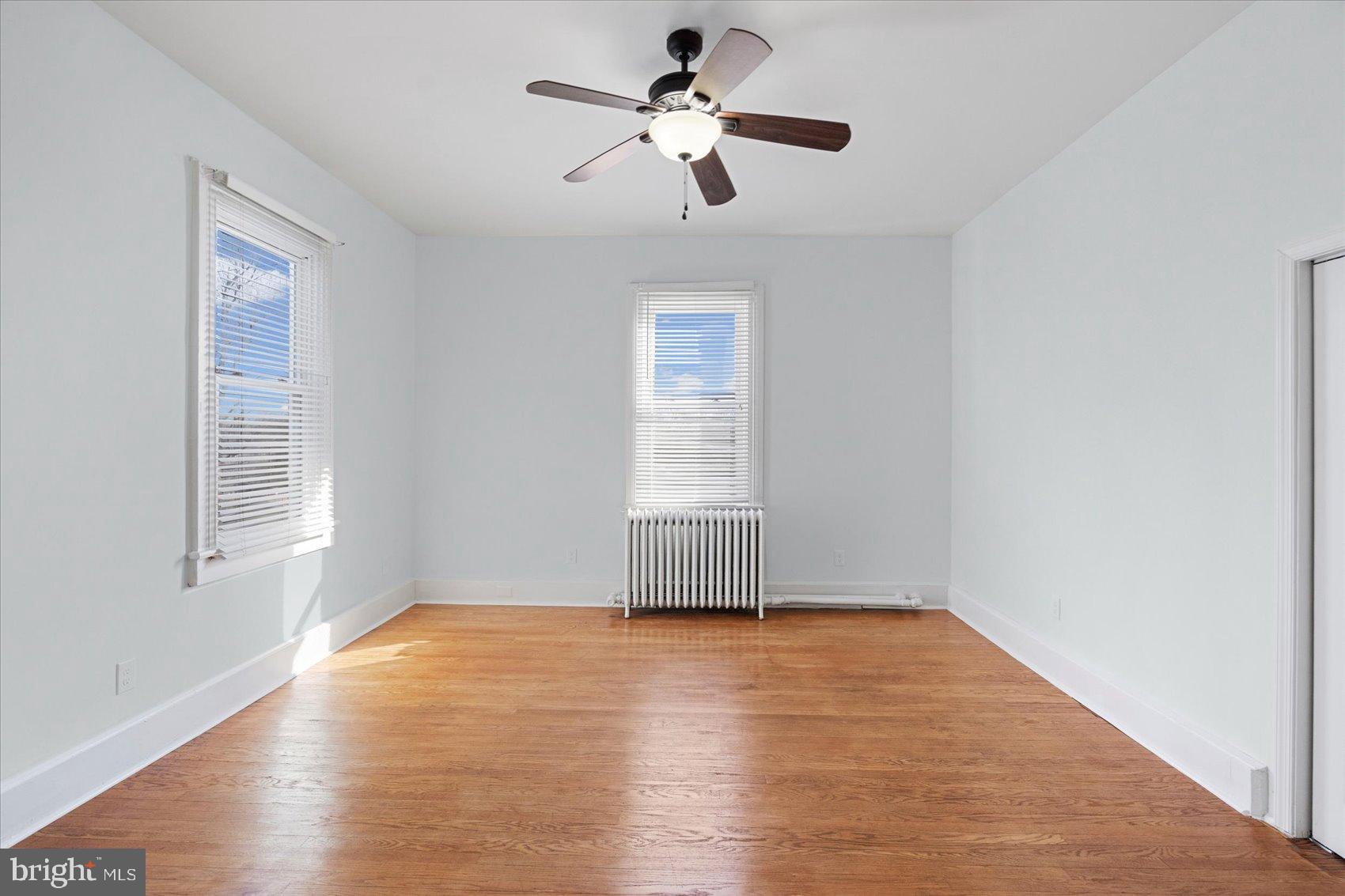 6602 Krone Drive Baltimore, MD 21207 - Photo 35 of 49 a view of empty room with wooden floor and fan