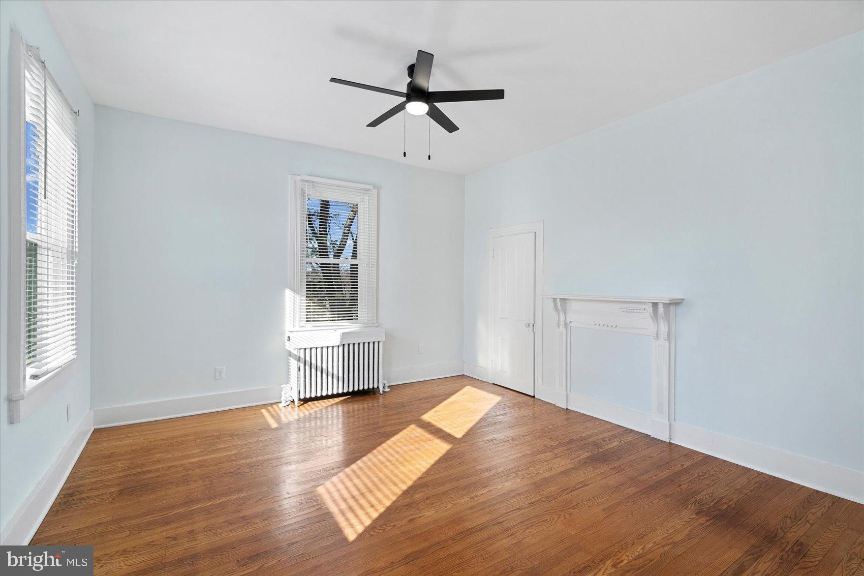 6602 Krone Drive Baltimore, MD 21207 - Photo 42 of 49 a view of empty room with wooden floor and fan
