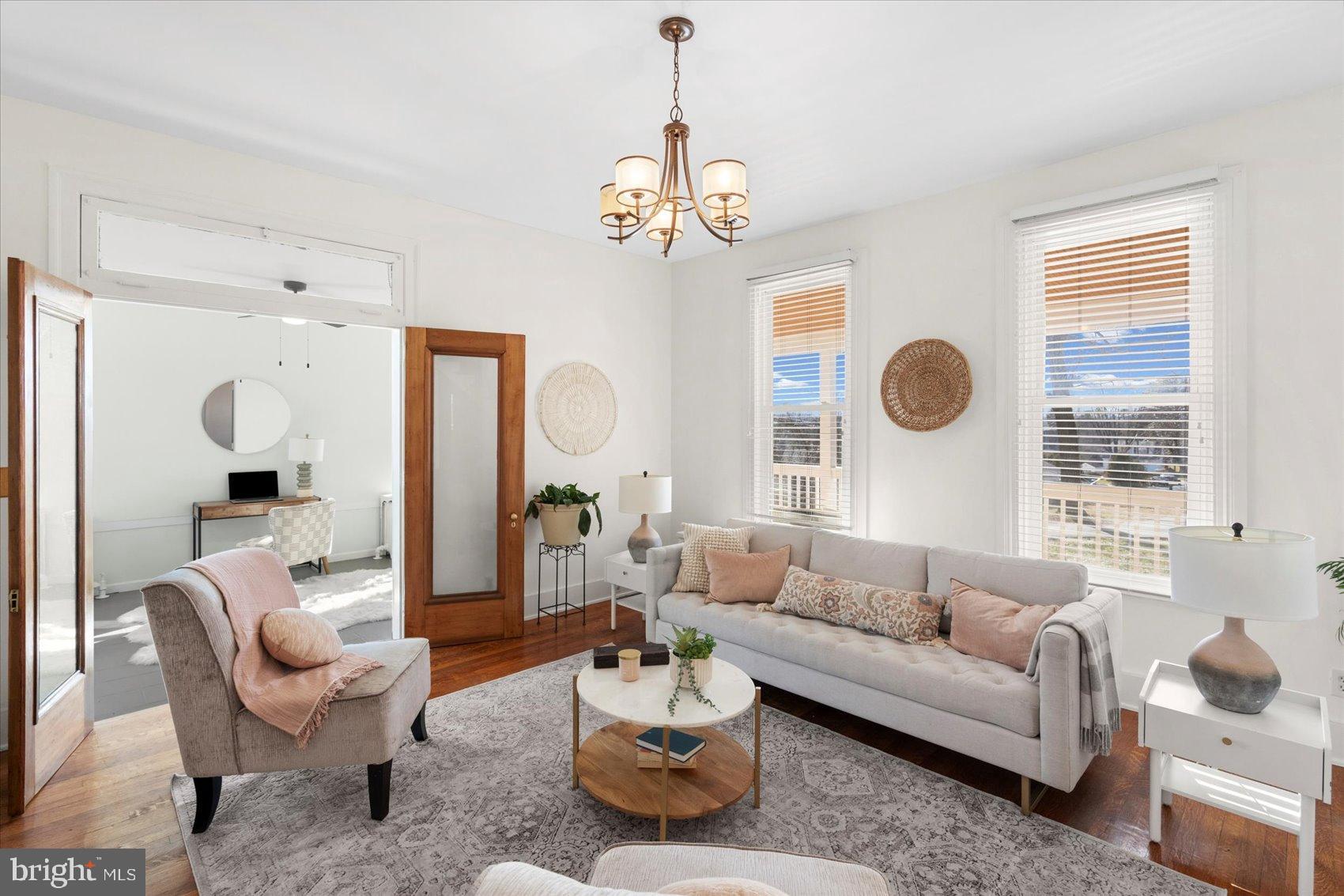 6602 Krone Drive Baltimore, MD 21207 - Photo 6 of 49 a living room with furniture chandelier and a window