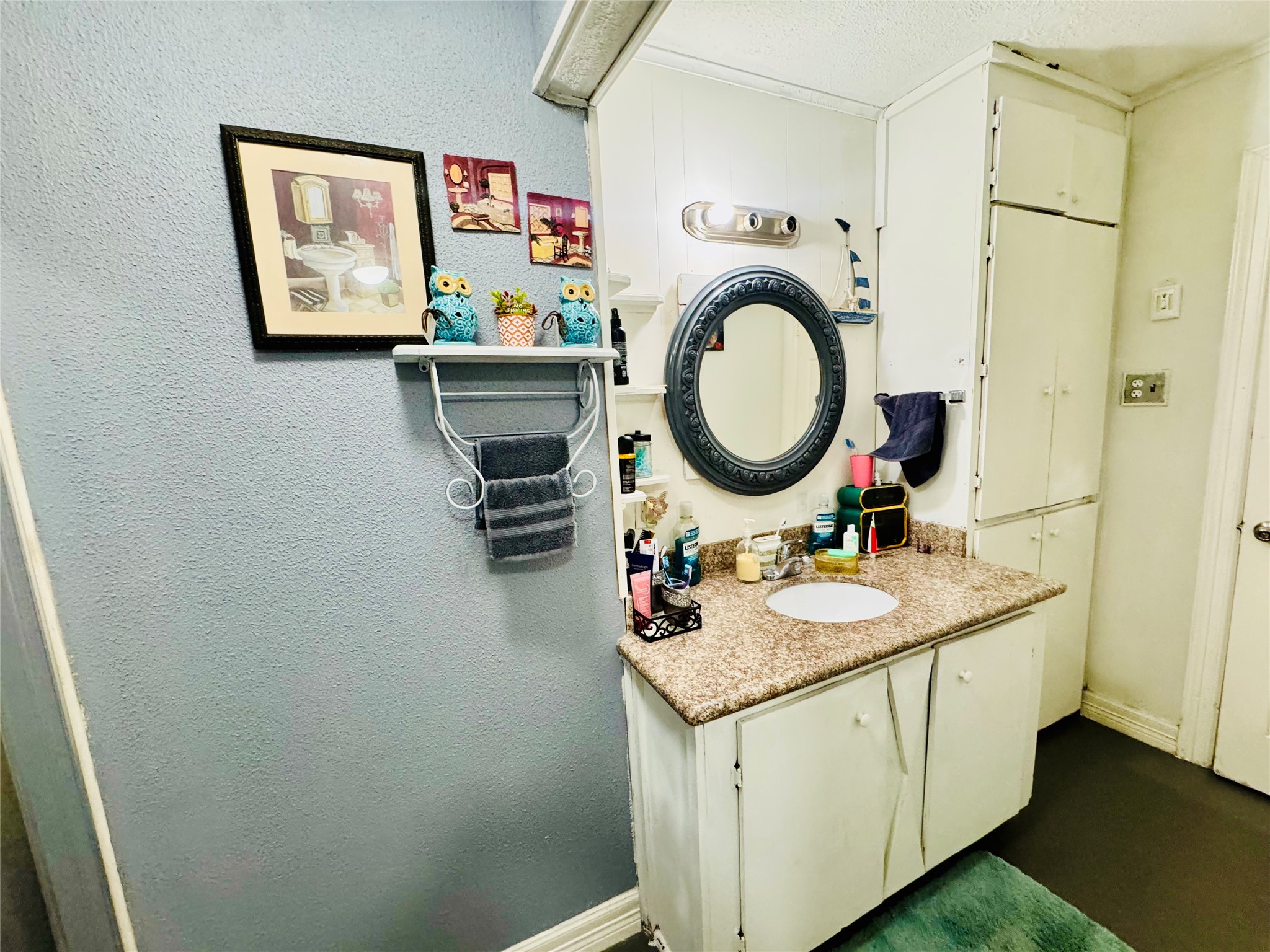9105 Exeter Street Houston, TX 77093 - Photo 9 of 21 a bathroom with a granite countertop sink and a mirror