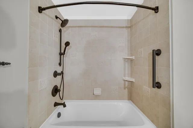 a bathroom with a bath tub