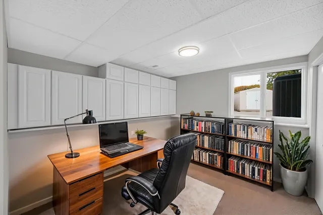 a workspace with furniture and book shelf