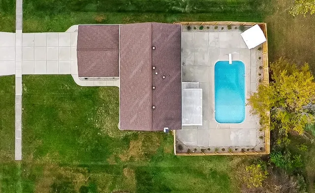 an aerial view of a house with a garden