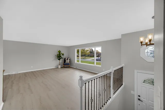 a view of a hallway with windows