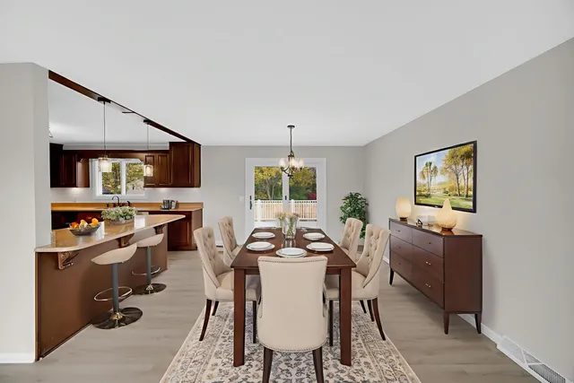 a dining room with furniture and window