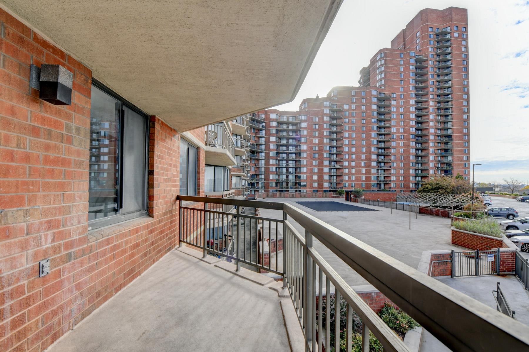 232 Harmon Cove Tower, Unit 232 Secaucus, NJ 07094 - Photo 14 of 47 a view of a balcony with outdoor seating