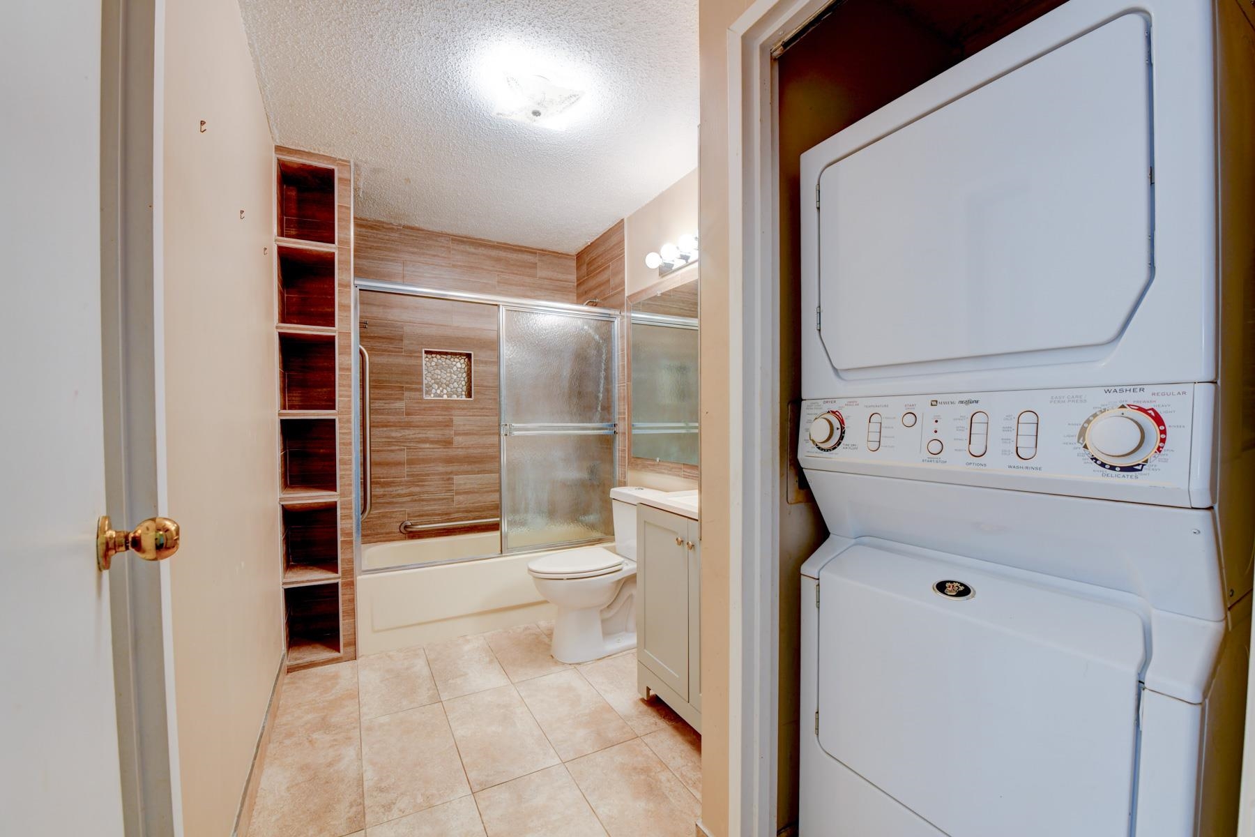 232 Harmon Cove Tower, Unit 232 Secaucus, NJ 07094 - Photo 15 of 47 a bathroom with a toilet and a shower