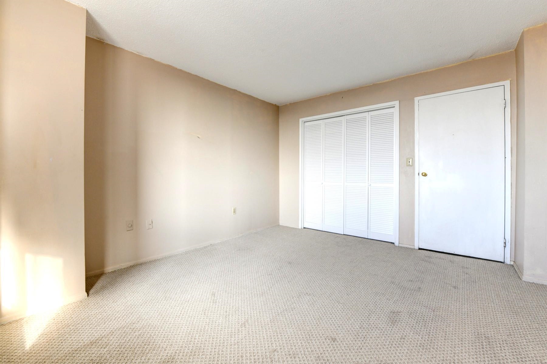 232 Harmon Cove Tower, Unit 232 Secaucus, NJ 07094 - Photo 20 of 47 a view of an empty room and a window