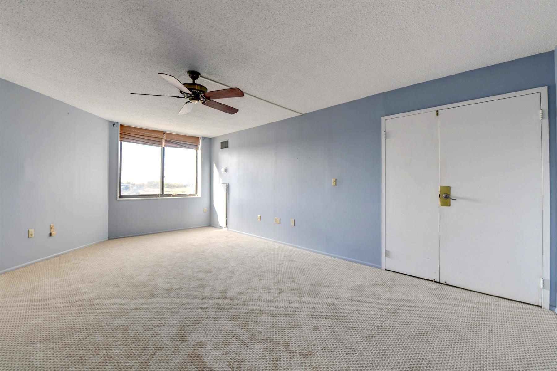 232 Harmon Cove Tower, Unit 232 Secaucus, NJ 07094 - Photo 23 of 47 a view of an empty room with a window