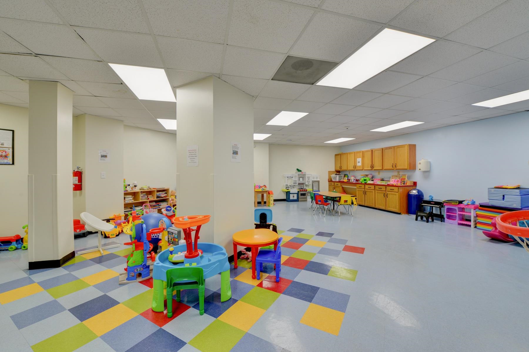 232 Harmon Cove Tower, Unit 232 Secaucus, NJ 07094 - Photo 30 of 47 a play room with toys and a soccer table