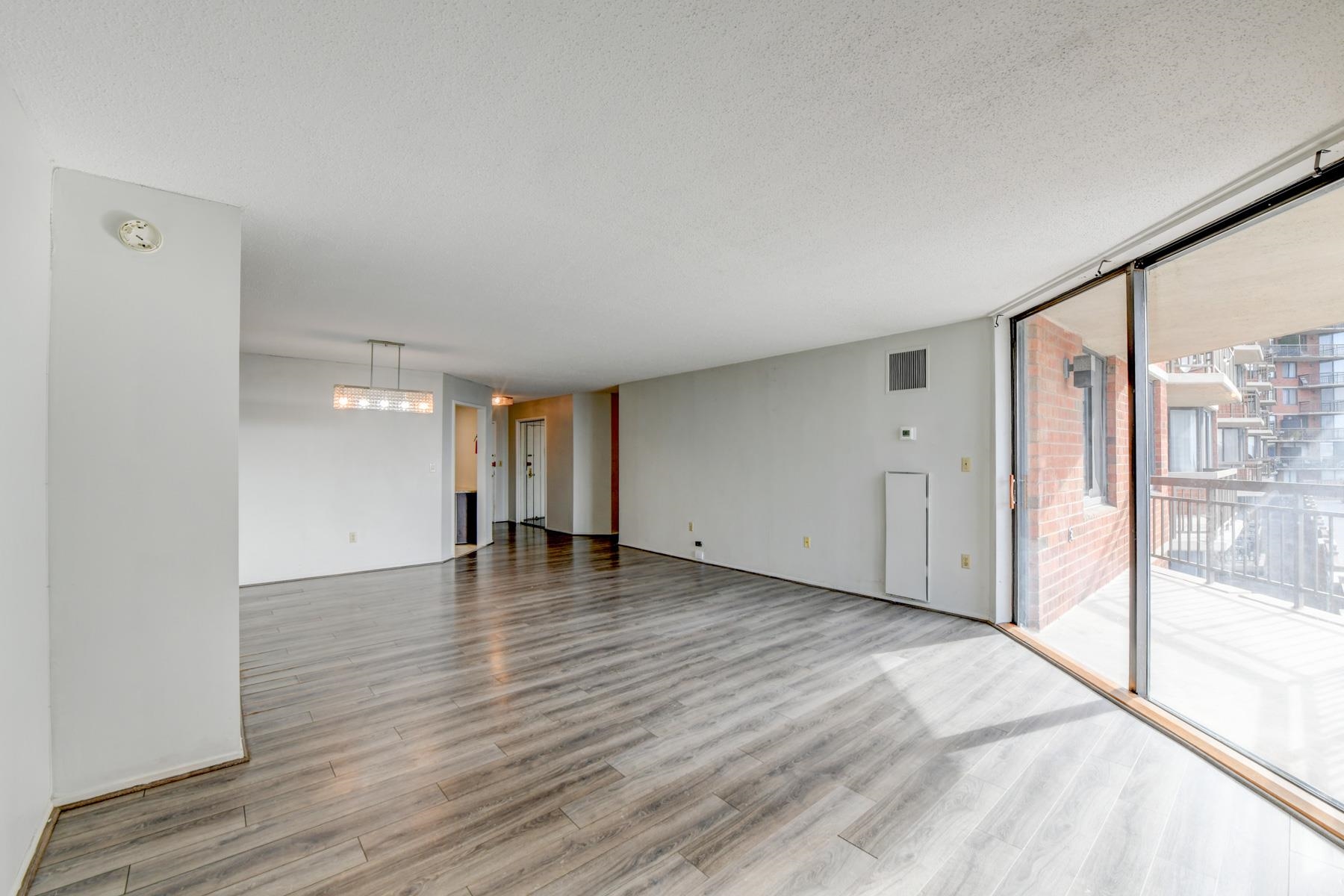 232 Harmon Cove Tower, Unit 232 Secaucus, NJ 07094 - Photo 3 of 47 a view of empty room with wooden floor and fan