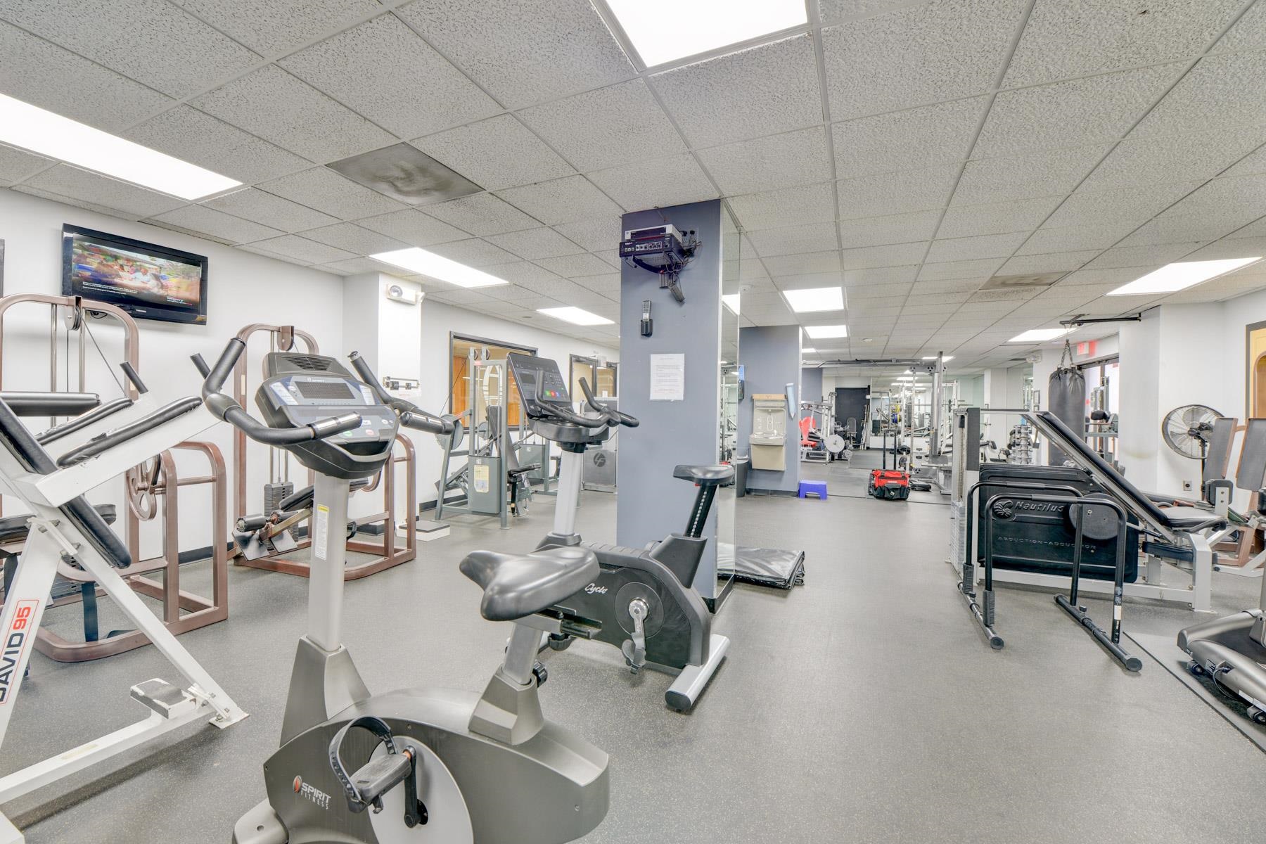 232 Harmon Cove Tower, Unit 232 Secaucus, NJ 07094 - Photo 35 of 47 a view of a room with gym equipment