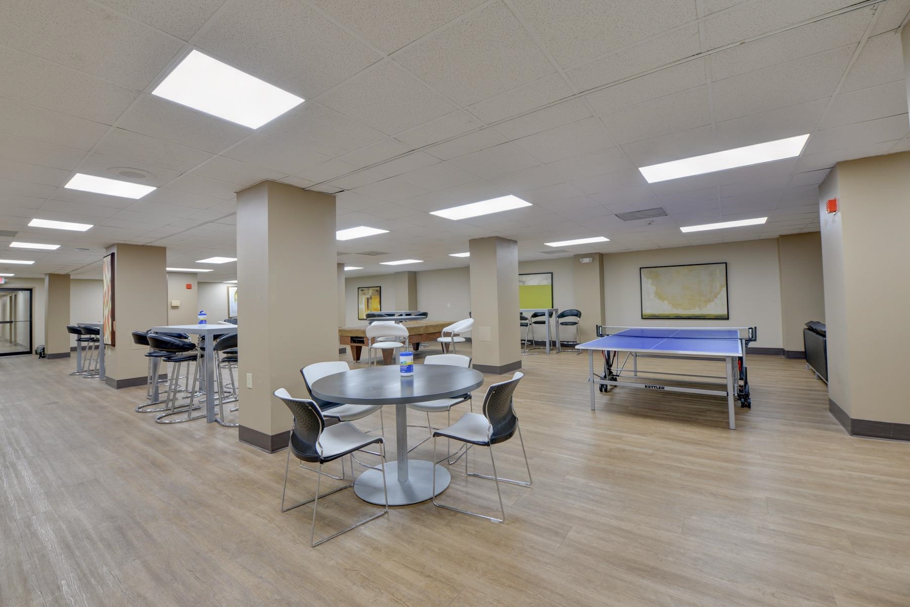 232 Harmon Cove Tower, Unit 232 Secaucus, NJ 07094 - Photo 36 of 47 a living room with furniture and a wooden floor