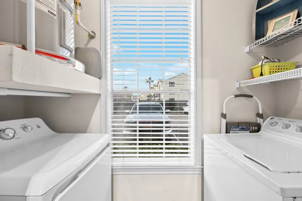 a bathroom with a granite countertop sink a toilet a mirror a bathtub and shower
