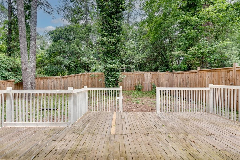 5611 Whittondale Road Lithonia, GA 30058 - Photo 27 of 34 a view of a wooden roof deck