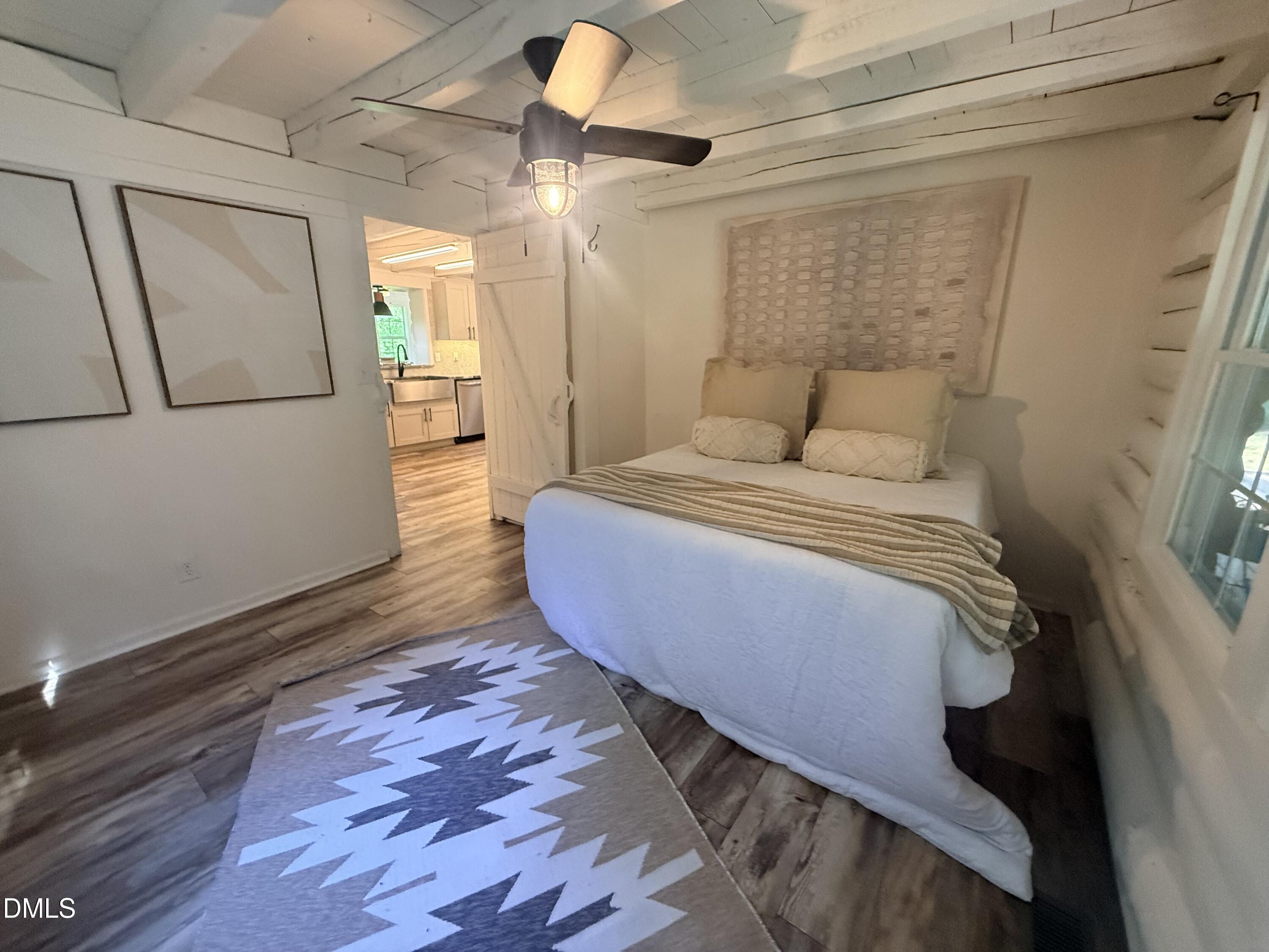 327 Shady Oak Road Roxboro, NC 27574 - Photo 31 of 62 a bedroom with a bed and a large mirror