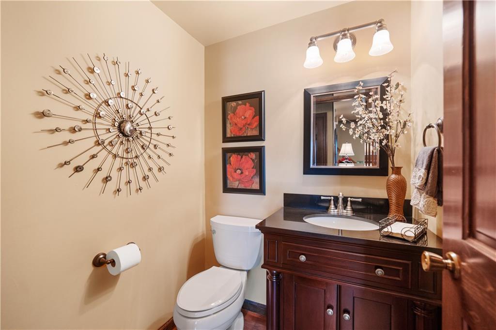 1002 Sundance Drive McKees Rocks, PA 15136 - Photo 14 of 25 a bathroom with a toilet a sink and mirror