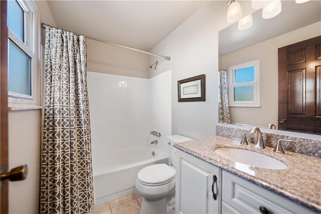 1002 Sundance Drive McKees Rocks, PA 15136 - Photo 17 of 25 a bathroom with a granite countertop sink toilet and shower