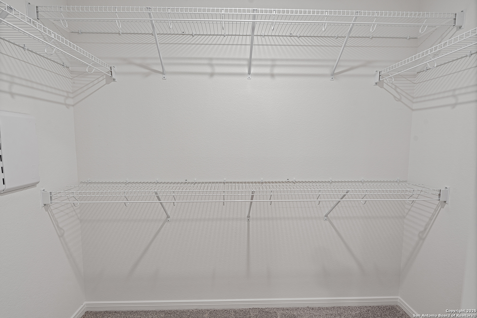 16148 Farmer Lytle, TX 78052 - Photo 16 of 33 a view of a room with racks on the wall