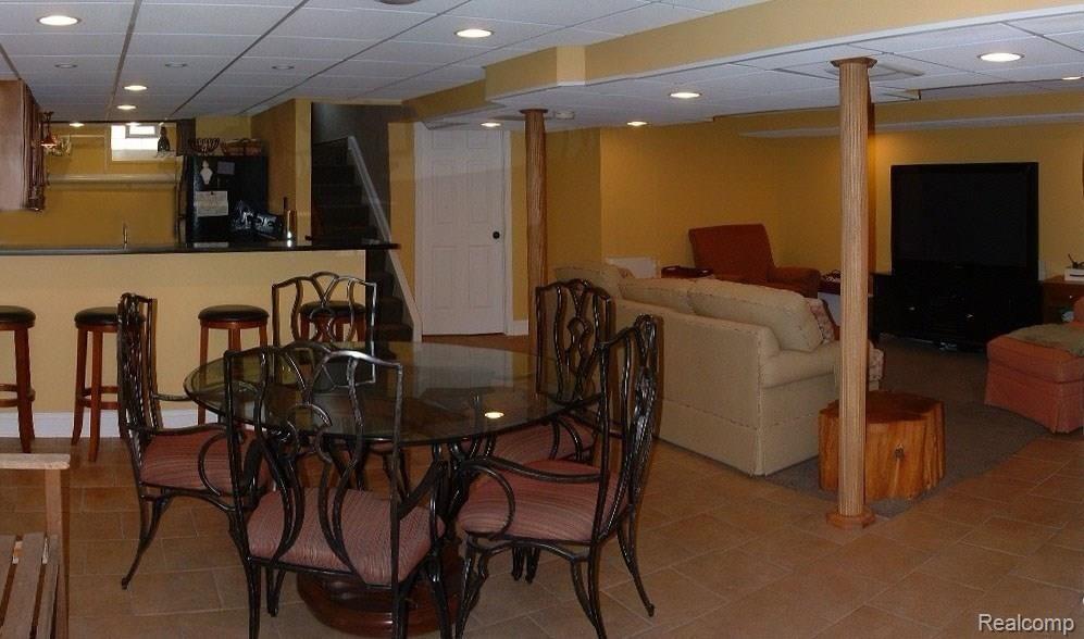 2478 Pembroke Road Birmingham, MI 48009 - Photo 31 of 38 Fantastic finished lower level with granite wet bar, full granite kitchen including all appliances, gathering room/game room, full bath, storage room/workshop, ceramic tile, & recessed lights
