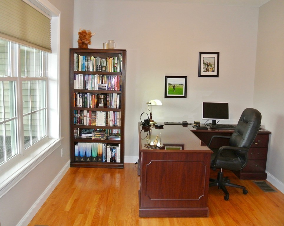 92 Robin Hill Road Groton, MA 01450 - Photo 12 of 30 a living room with furniture and a floor to ceiling window