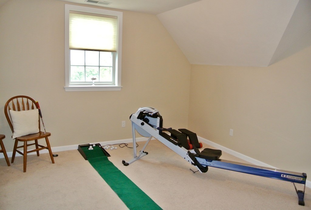 92 Robin Hill Road Groton, MA 01450 - Photo 25 of 30 a room with gym equipment and window